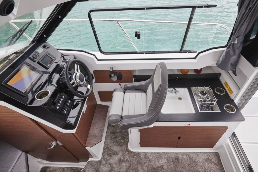 Jeanneau Merry Fisher 795 - wheelhouse starboard side helm position and aft galley