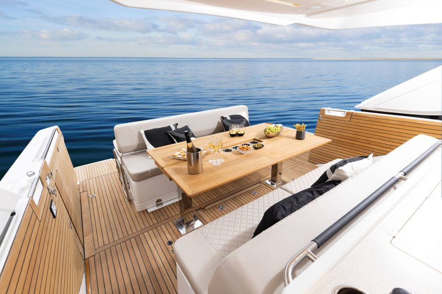 Jeanneau DB 43 inboard day boat - aft cockpit table and sofas