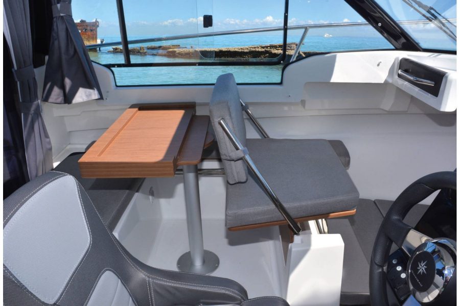 Jeanneau Merry Fisher 695 - co-pilot seat converts to seating at table
