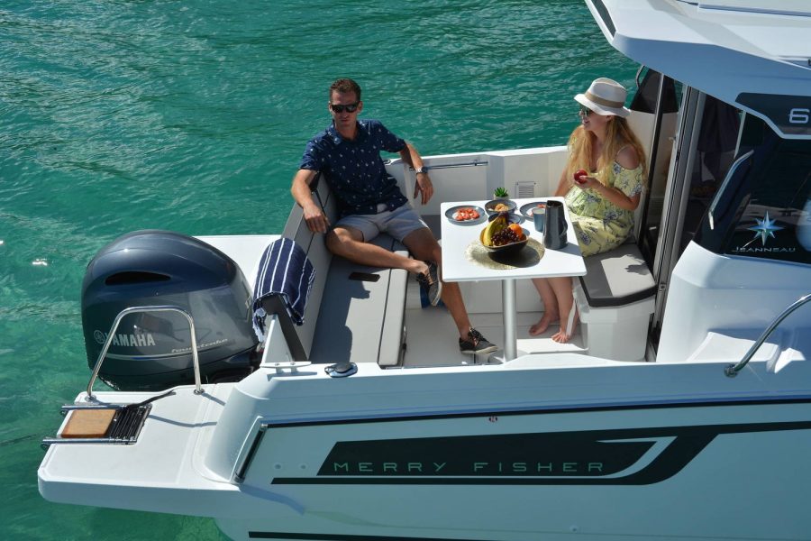 Jeanneau Merry Fisher 695 - relaxing in the aft cockpit U-shape seating and table