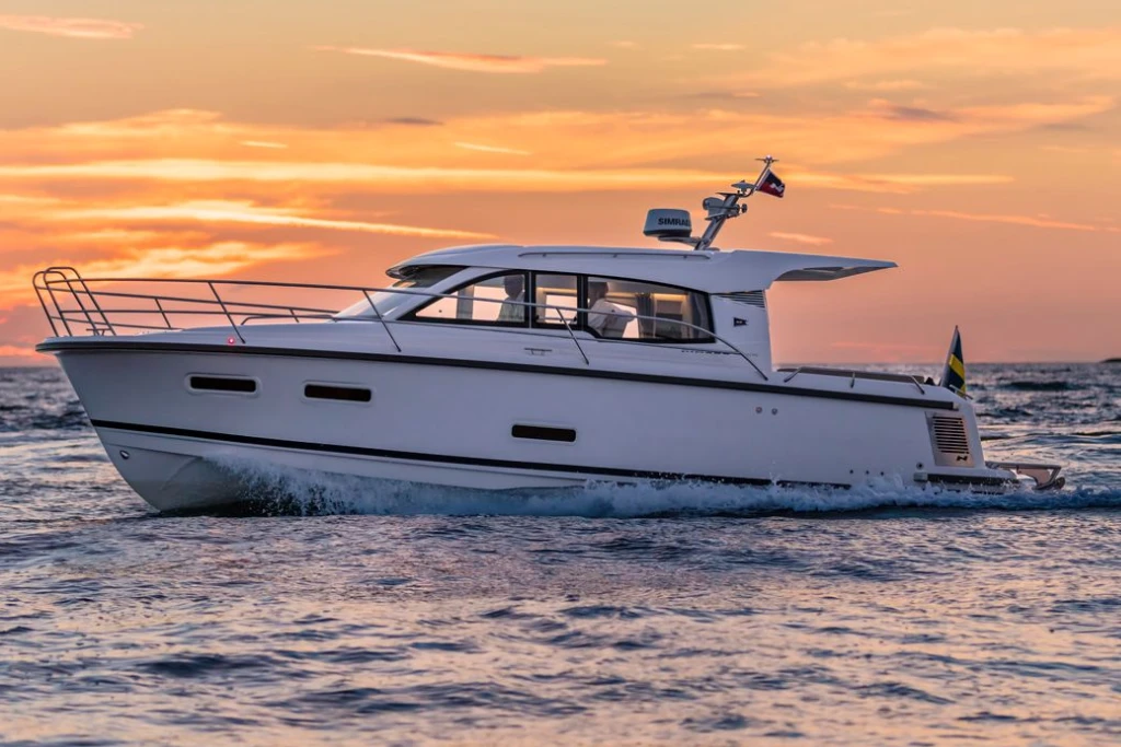 Nimbus 305 coupe at sea during sunset