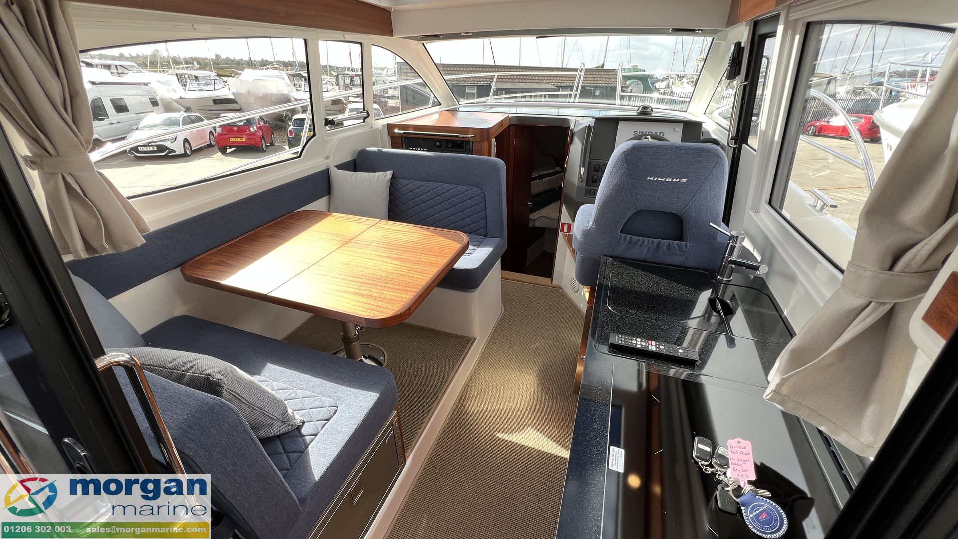 Nimbus 305 Coupe - wheelhouse with saloon seating and galley